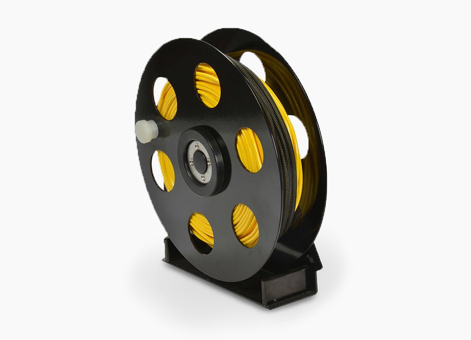 Heavy duty tether reel with bearings and electrical slip ring for easy tether management