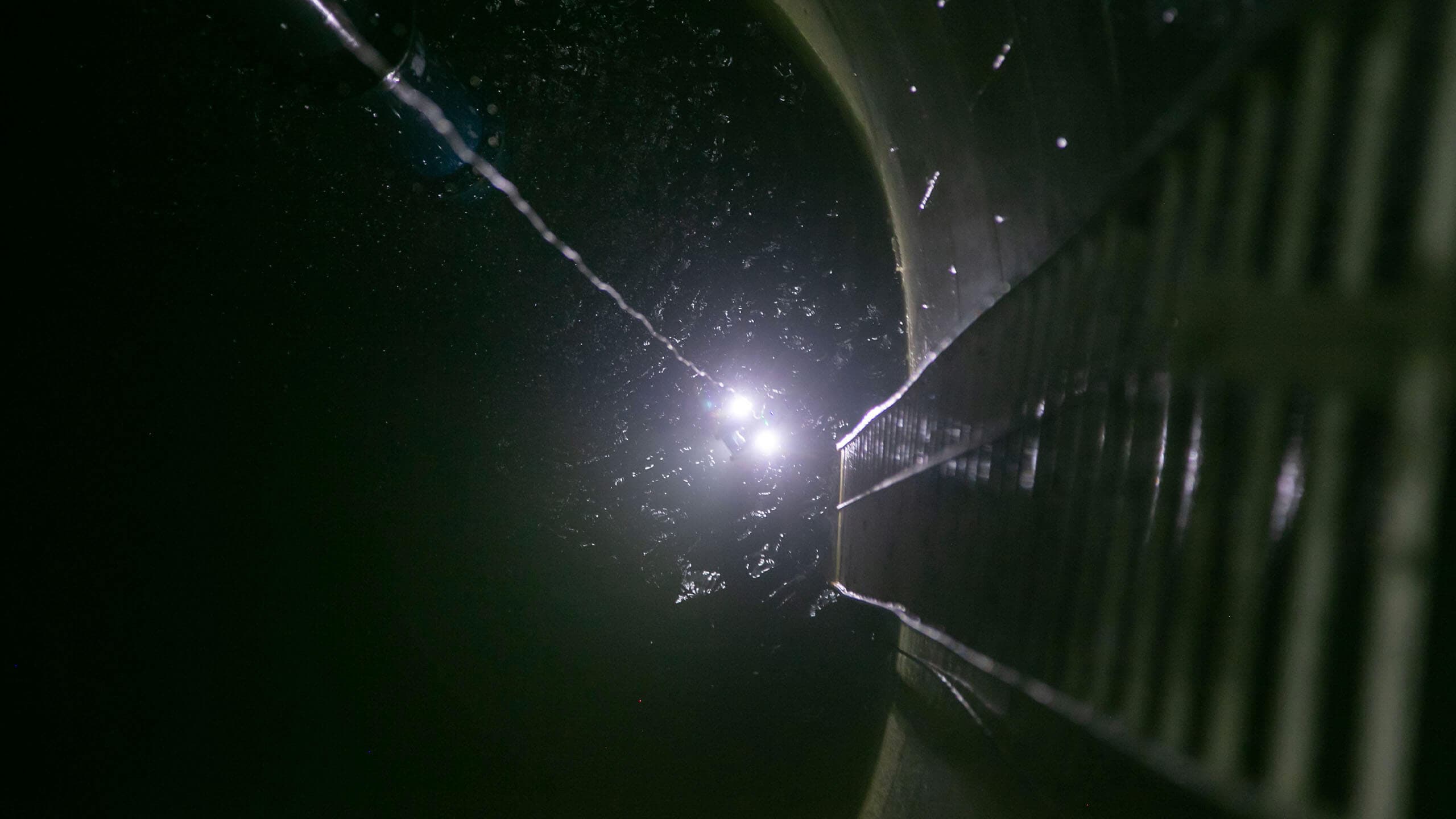 Deep Trekker DTG3 ROV underwater in tank looking up at camera