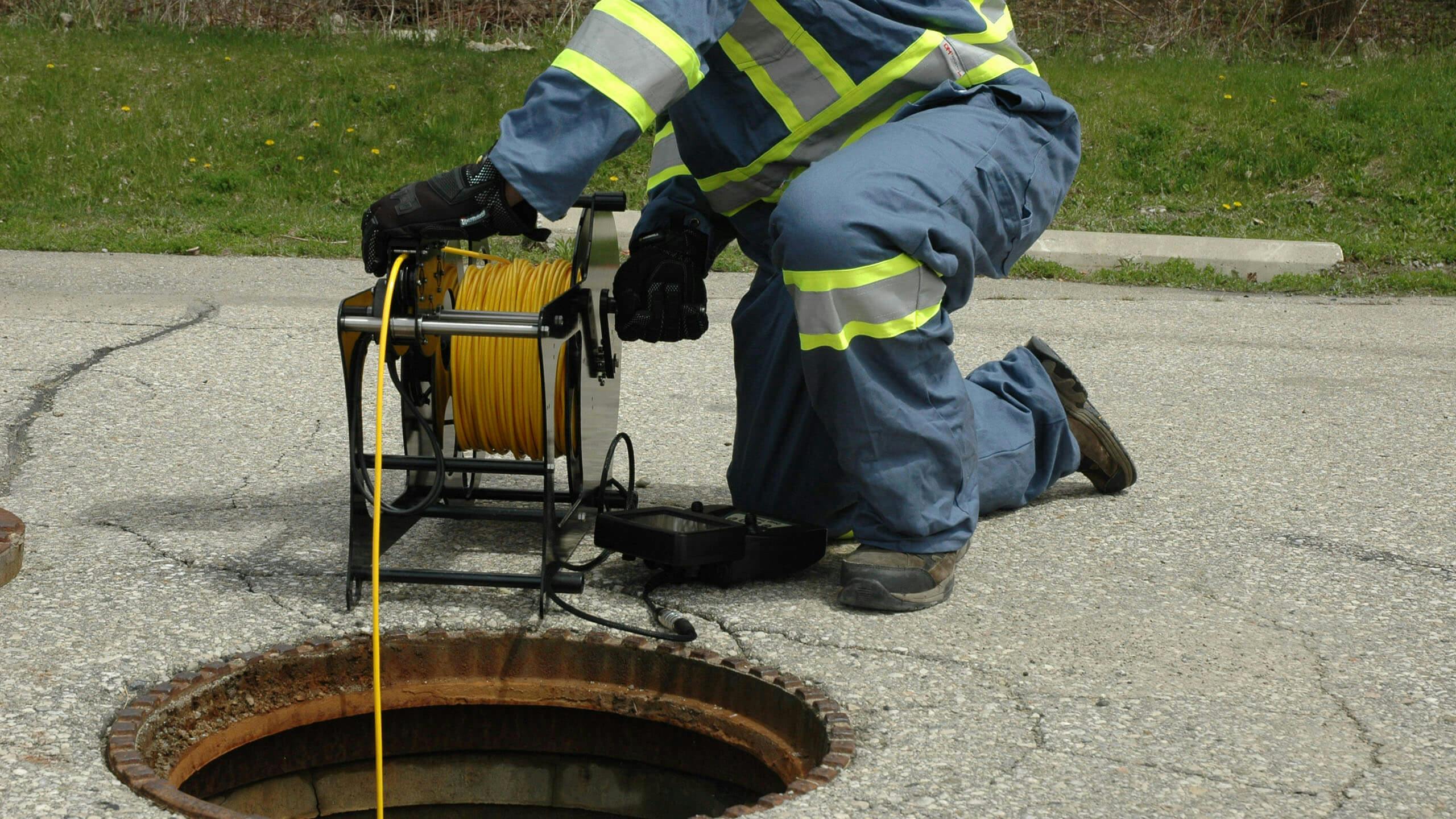 Power reel going into man hole 