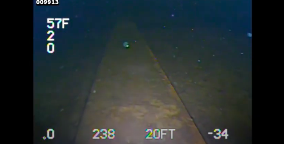 Underwater view of dam inspection in murky water with a DTG3 ROV