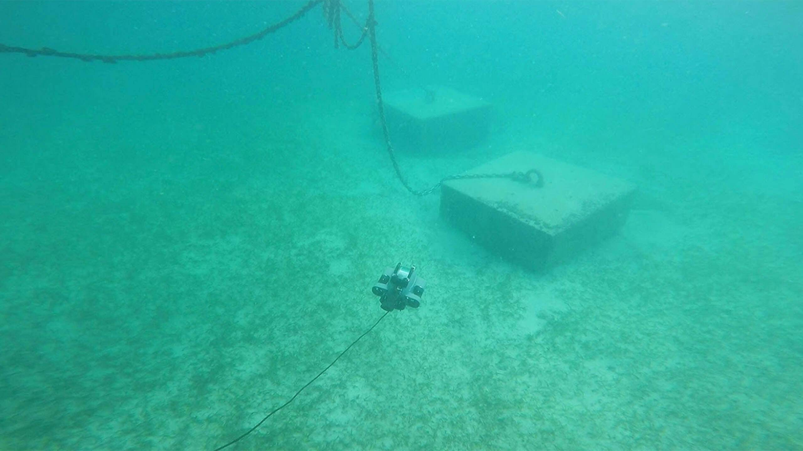 Deep Trekker DTG3 ROV drives underwater towards concrete block
