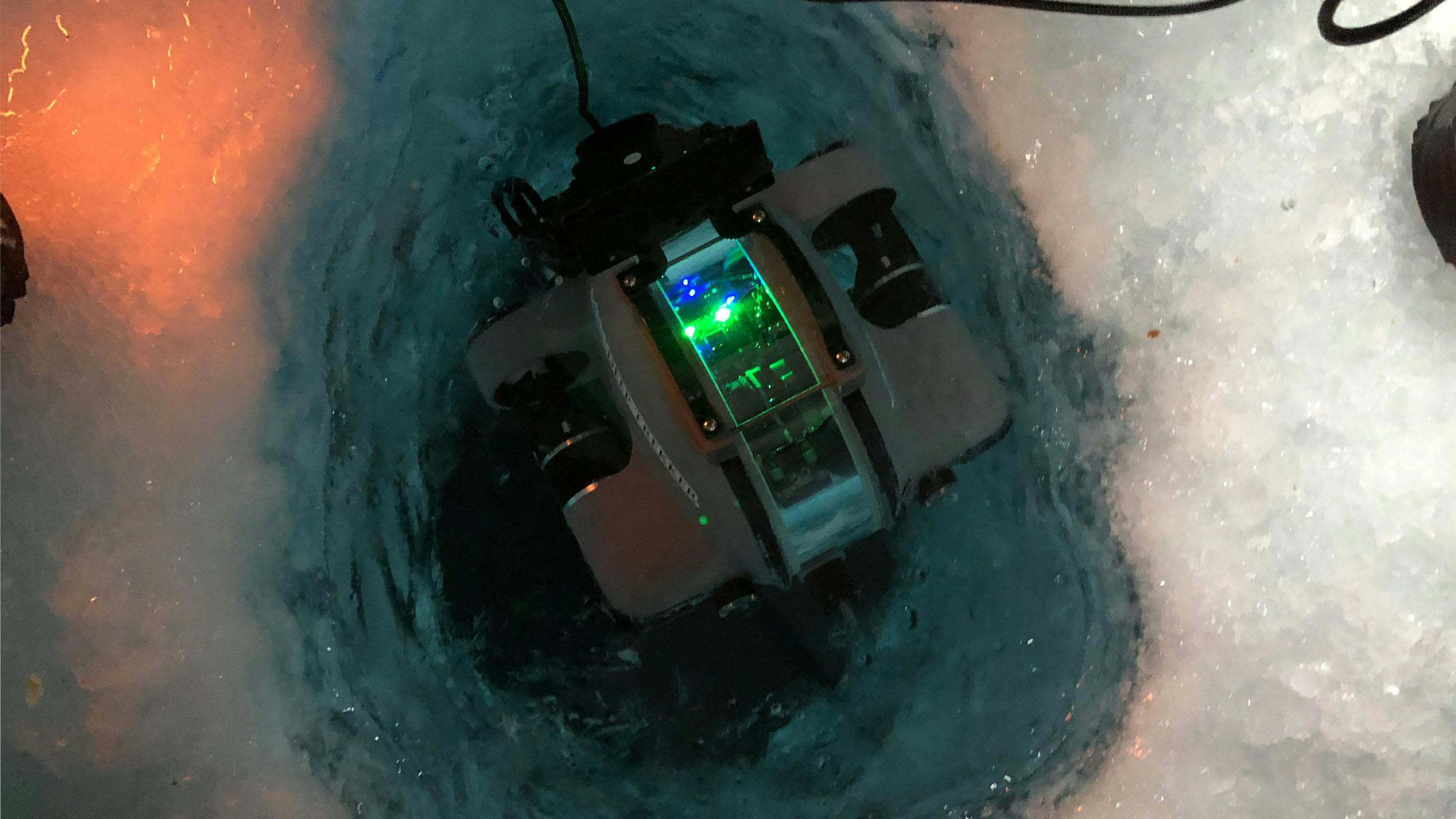 Deep Trekker DTG3 ROV diving under ice into water 
