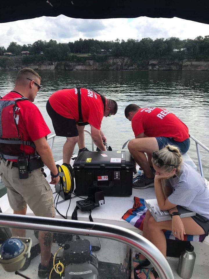 First responders working on a boat to deploy a DTG3