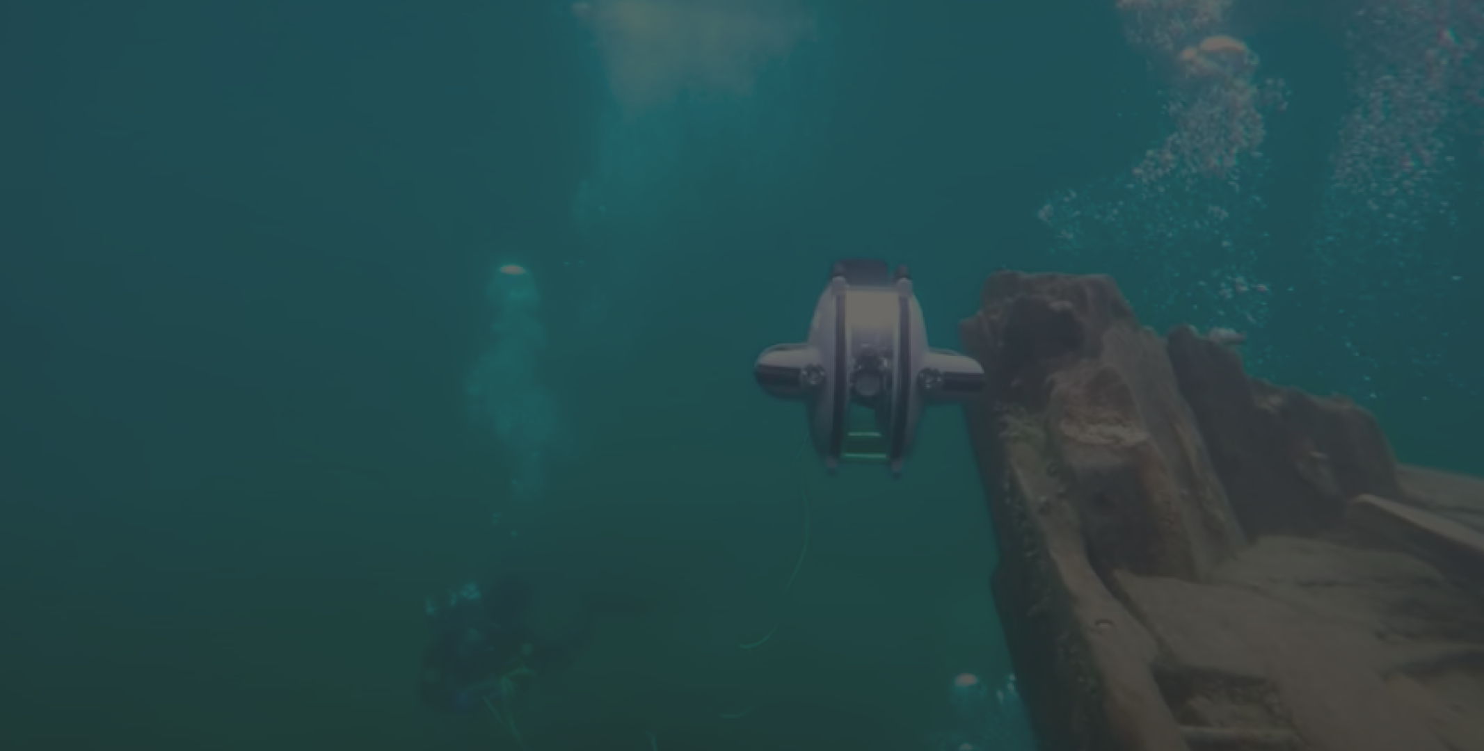 Deep Trekker DTG3 with underwater controller and diver underwater 