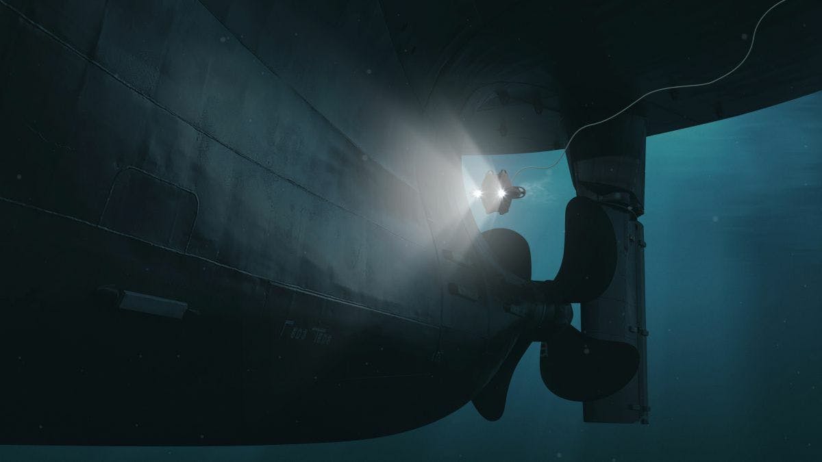 Deep Trekker DTG3 underwater drone inspecting a ship hull underwater.